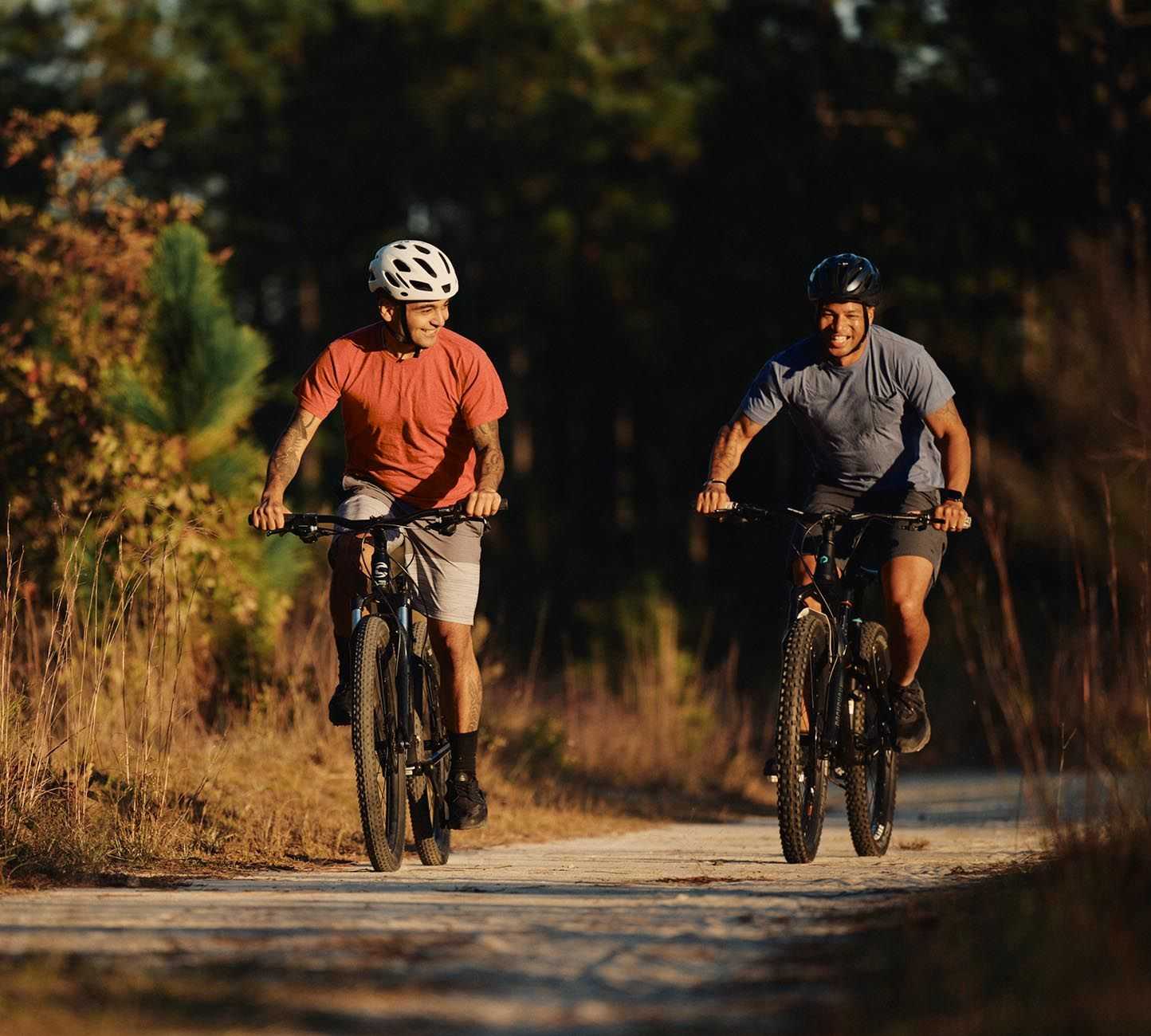 Two men riding their bikes